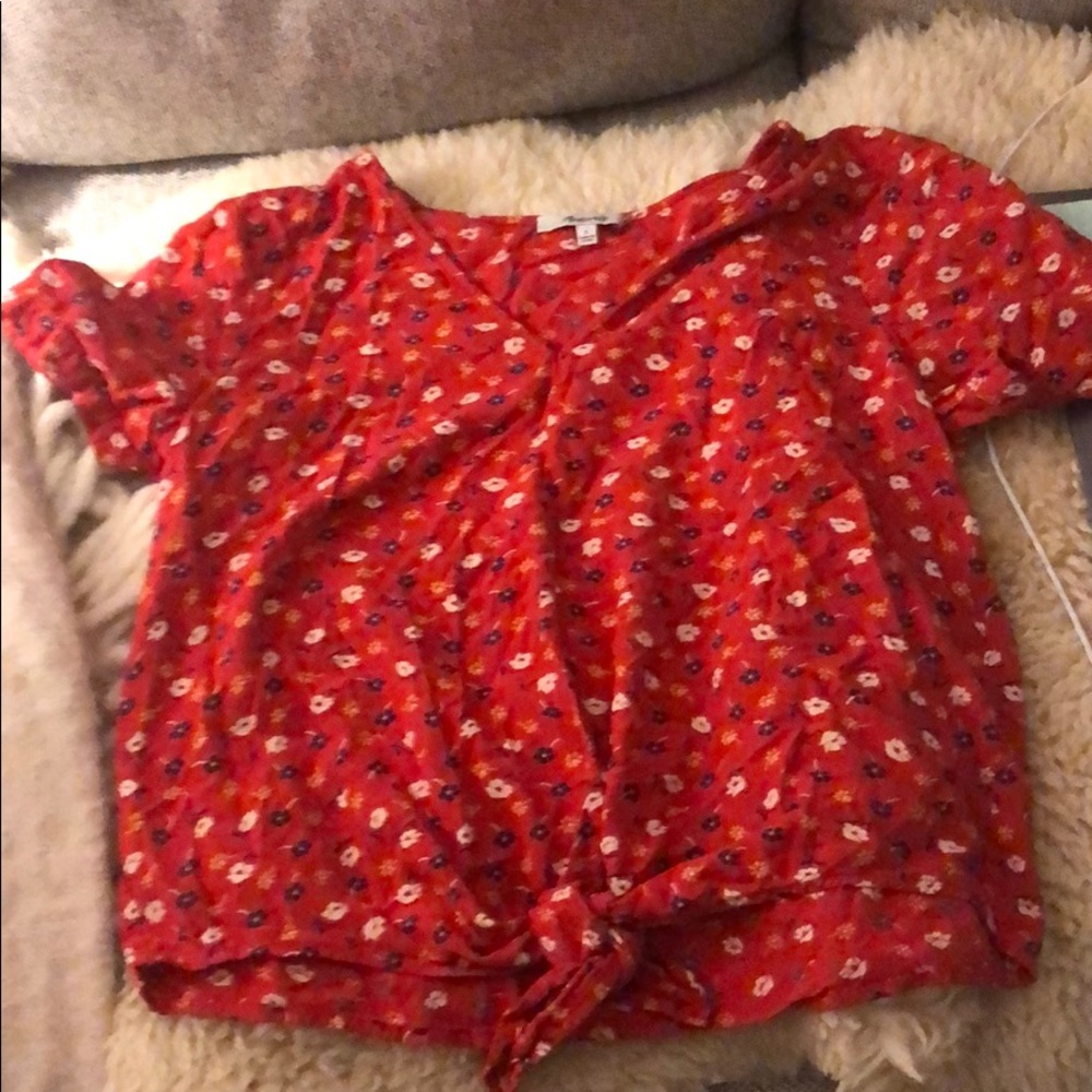 Floral blouse. Red with white and blue flowers.
